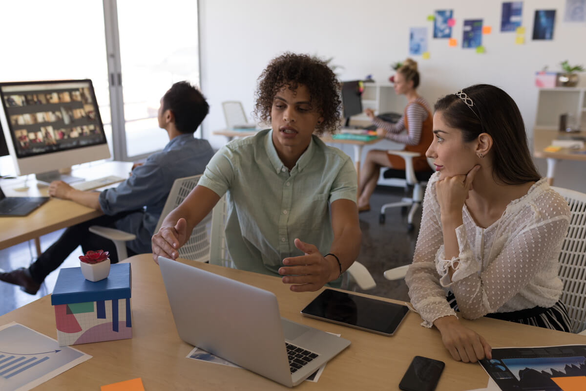 diverse-business-colleagues-discussing-business-st-ARYSFUZ.jpg